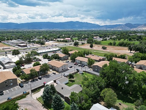arial view of a city with mountains in the background