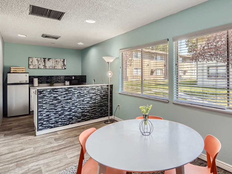 Clubhouse with table and kitchen area