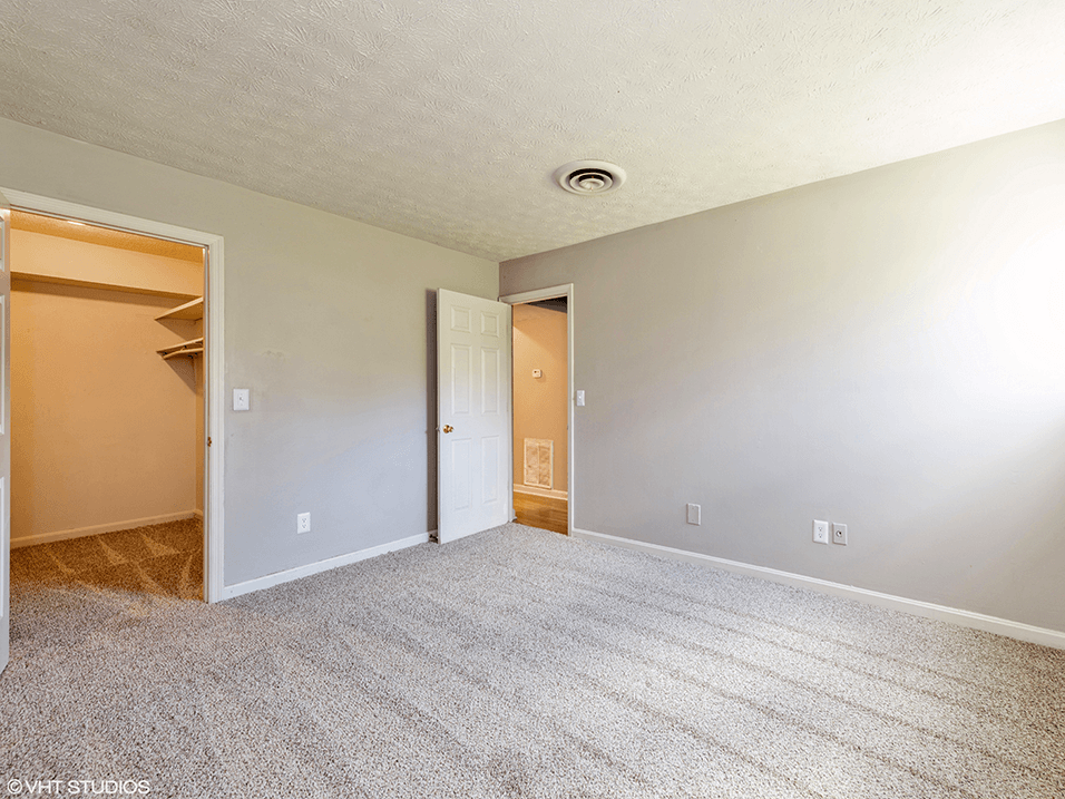 primary bedroom with walk-in closet