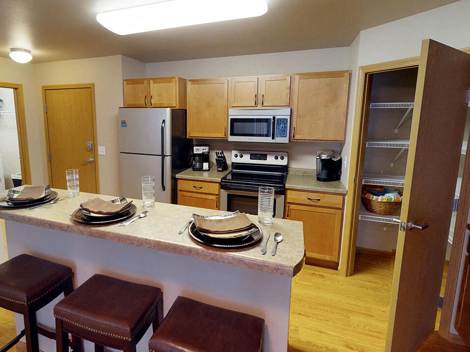 a kitchen with a center island and a stove top oven