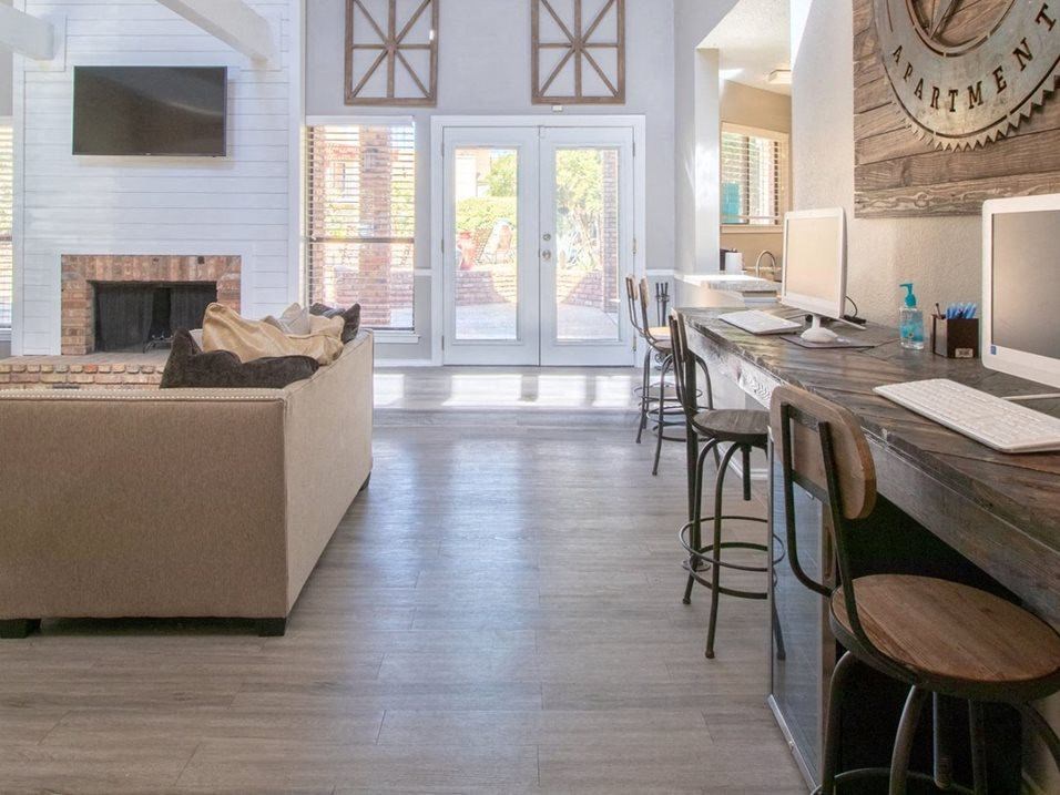 a living room with a couch and a bar and a fireplace