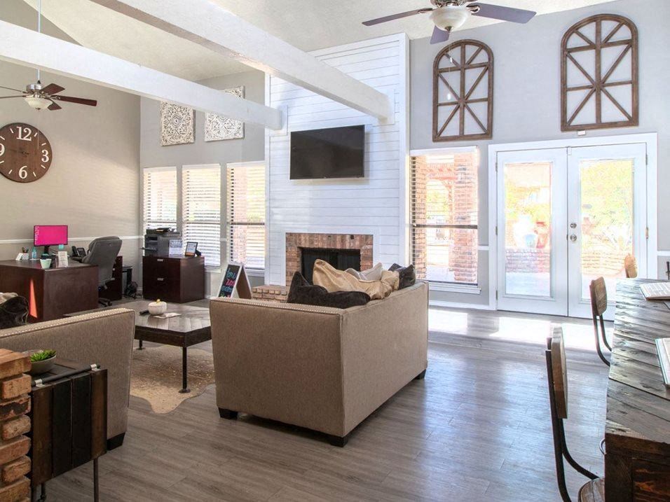 a living room with a couch and a fireplace