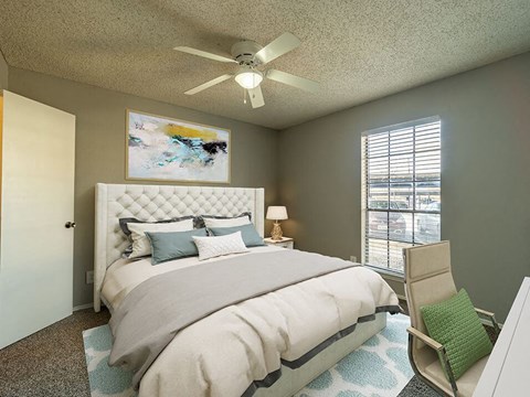 bedroom with overhead fan, light, and large window