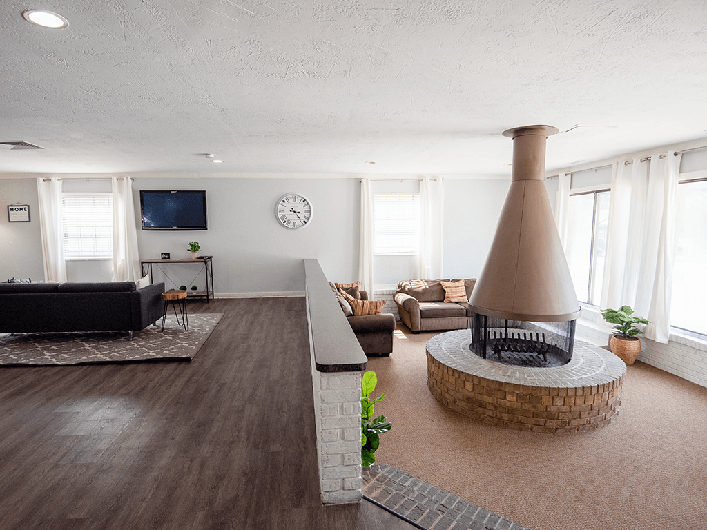 clubhouse with a fireplace and TV