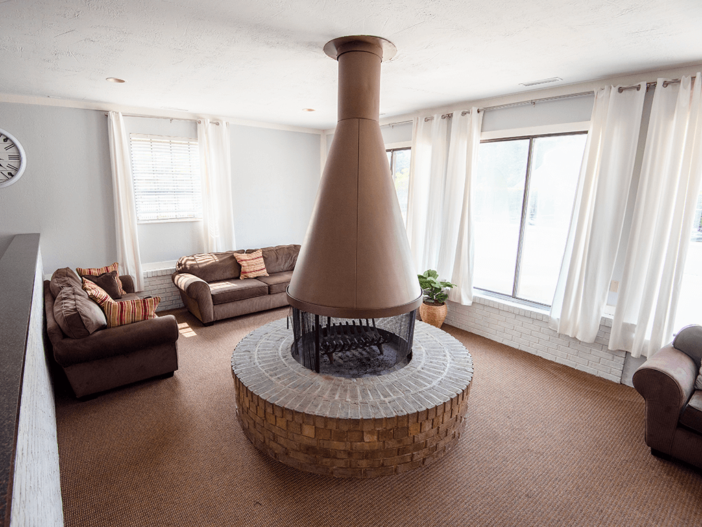 clubhouse with a fireplace and a couch.