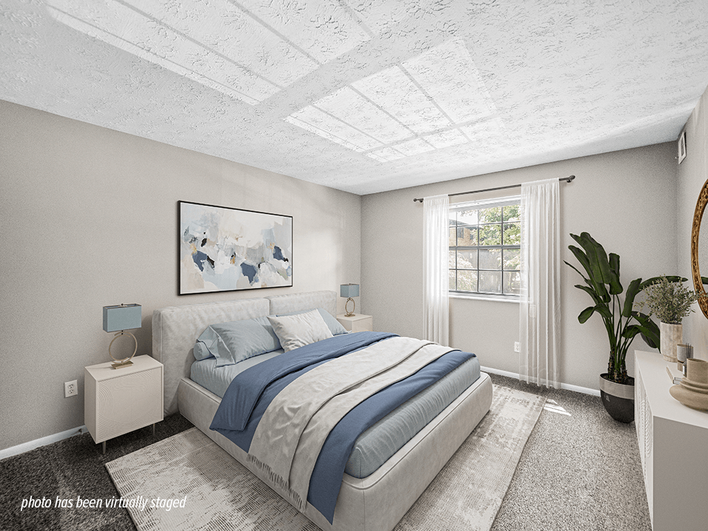 Apartment bedroom with natural light from big window