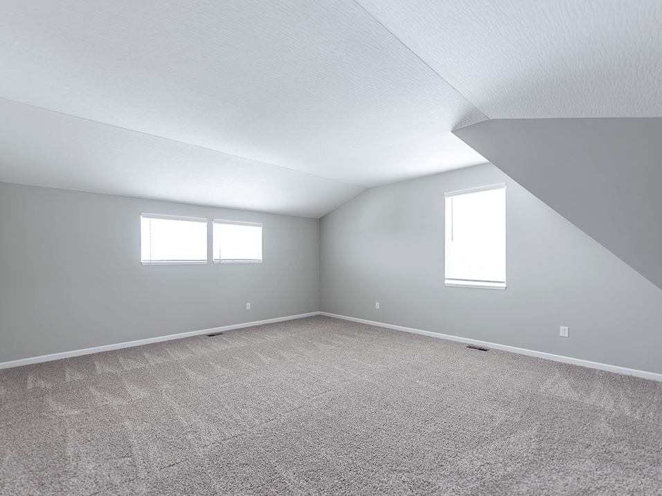 bedroom with a carpeted floor and windows