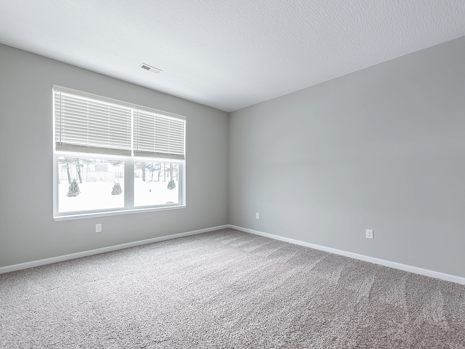 apartment bedroom with a large window