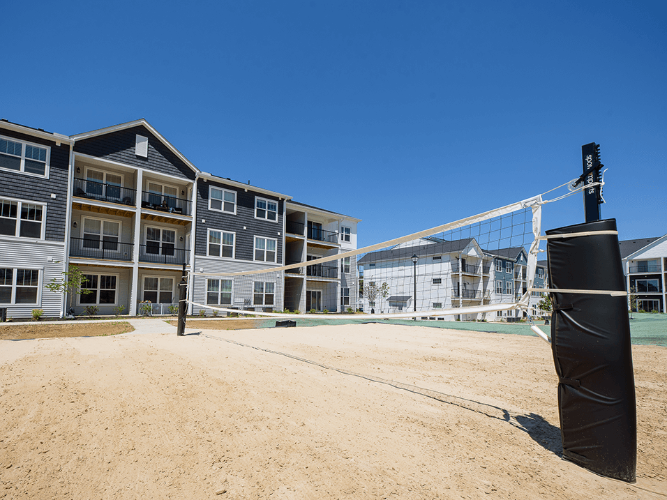 sandy volleyball court at apartment complex