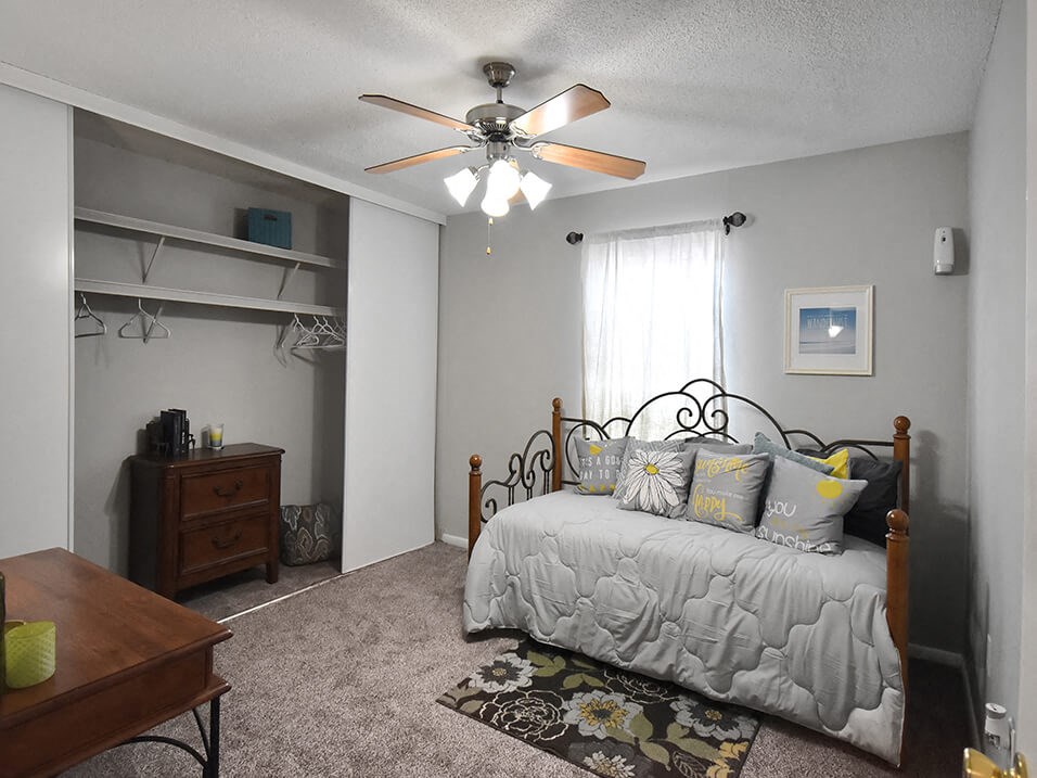 spacious bedroom with large closet and ooverhead lighting