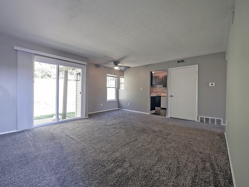apartment living room with sliding glass door