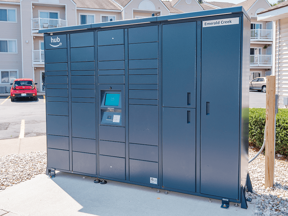 a lockers in a parking lot in front of an apartment building