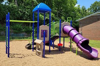 a playground with a slide and other play equipment