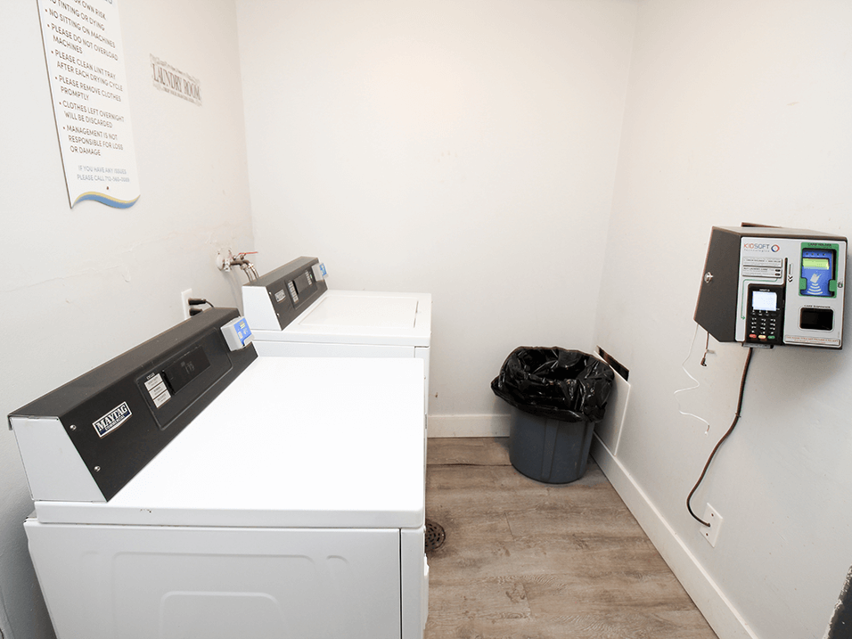 a laundry room with a washer and dryer
