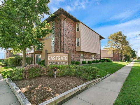 an image of the entrance to an apartment building with a sign that says eastgate apartments