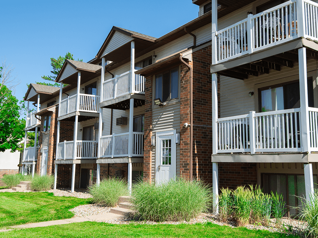 an exterior view of an apartment building with balconies