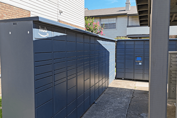 A dark blue wall with a sign that says Amazon hub on it.
