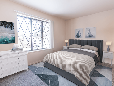 a bedroom with a bed and a window