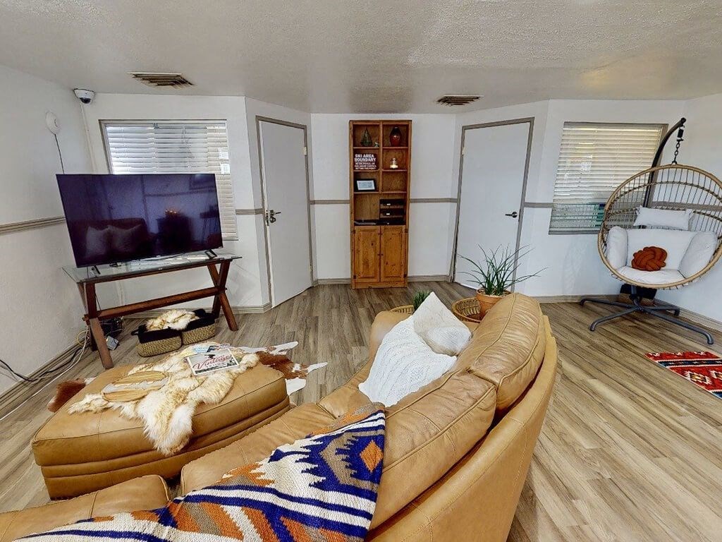 a clubhouse room with a couch and a television