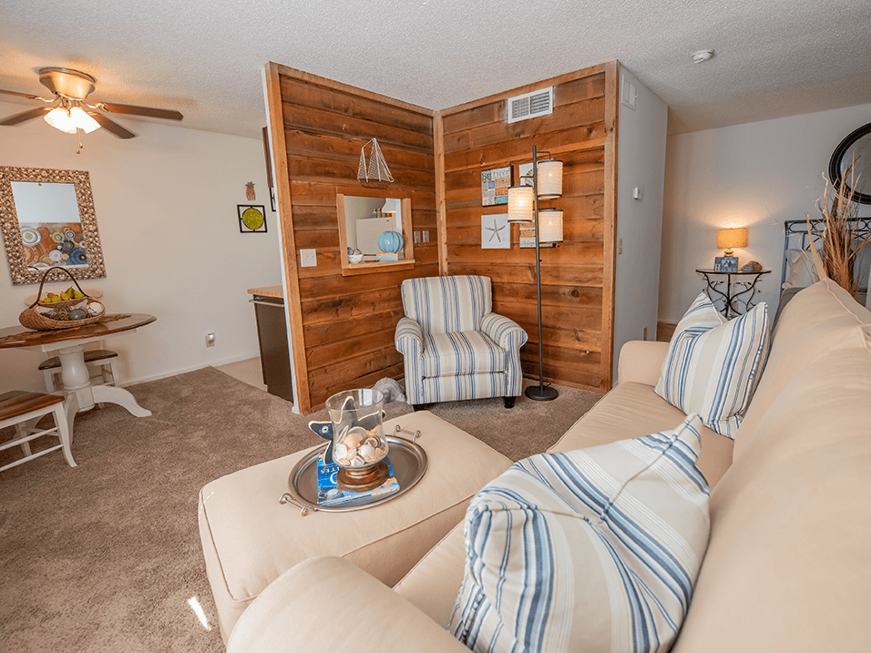 a living room with couches and chairs