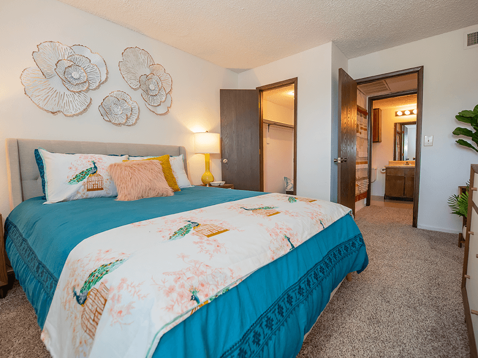 a large bedroom with walk-in closet and bathroom connected