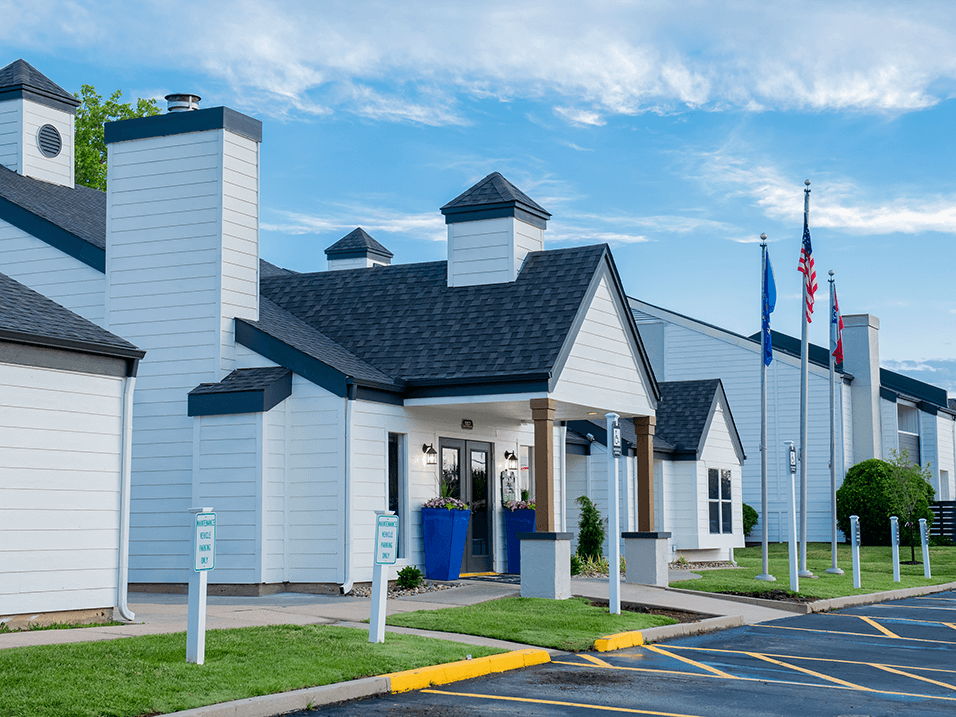 a white building with a black roof