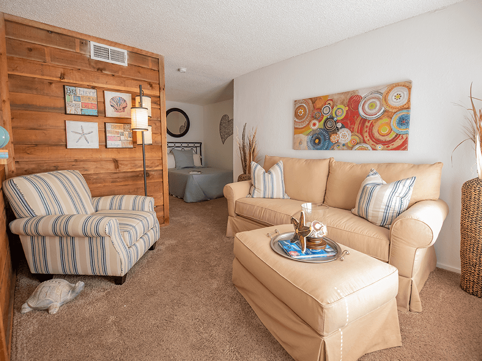 a living room with two couches and a chair