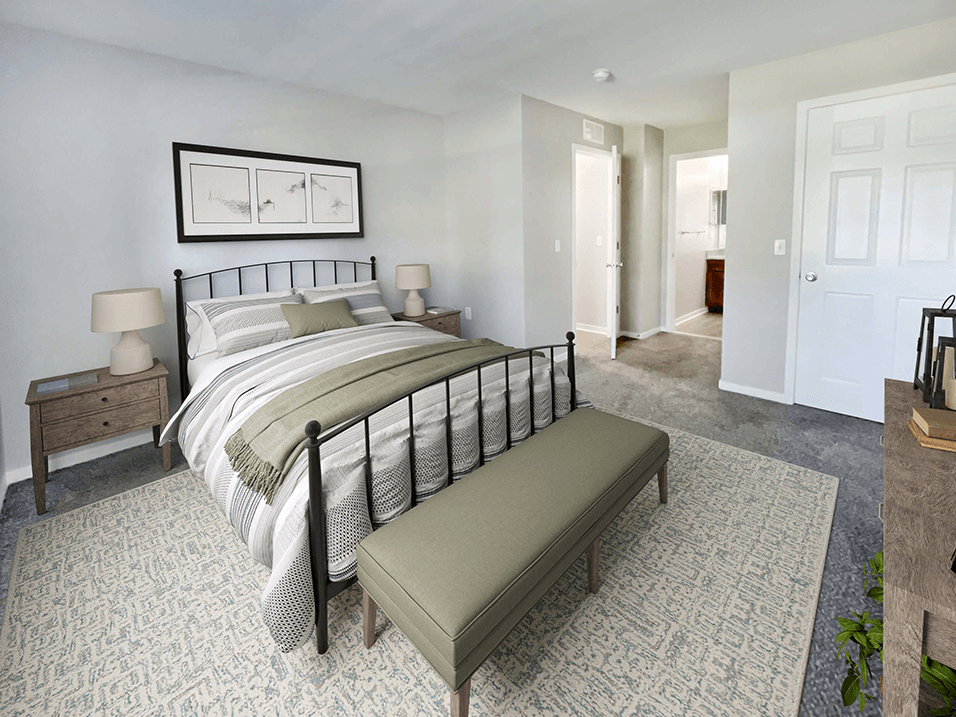 a bedroom with a bed and a couch