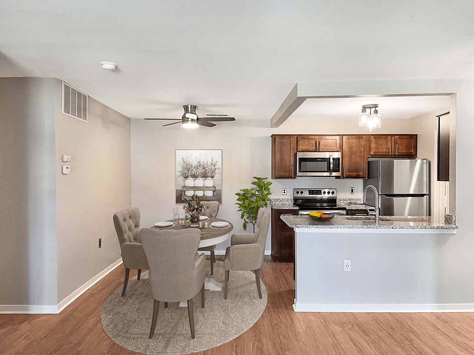 an open kitchen and dining room with a table and chairs