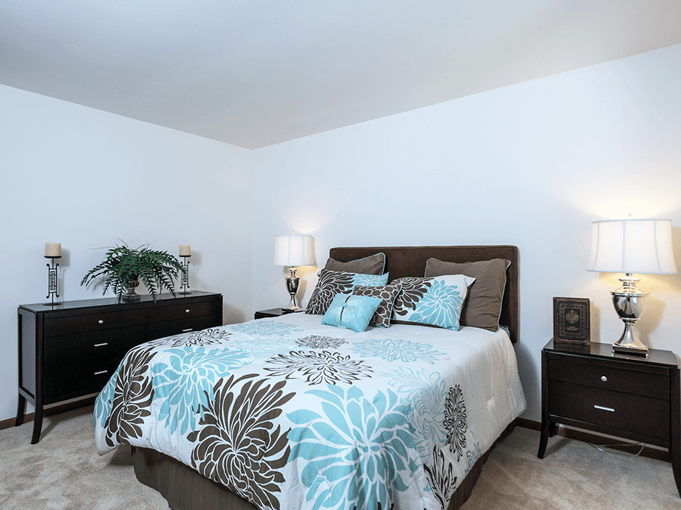 bedroom with a bed and two night stands