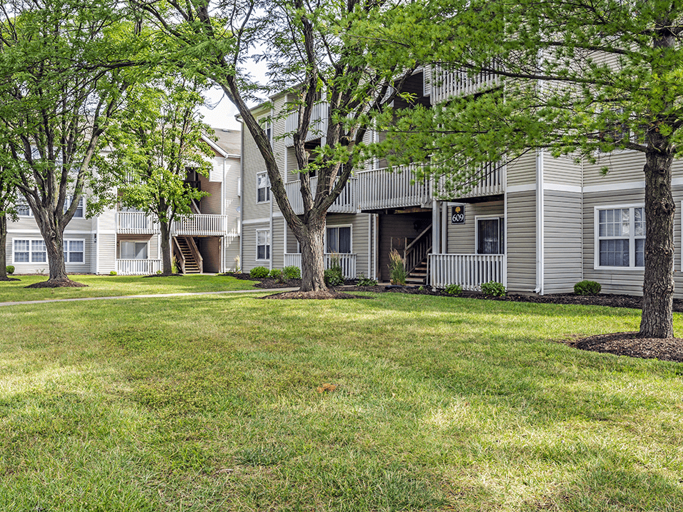 our apartments have green grass and shade trees