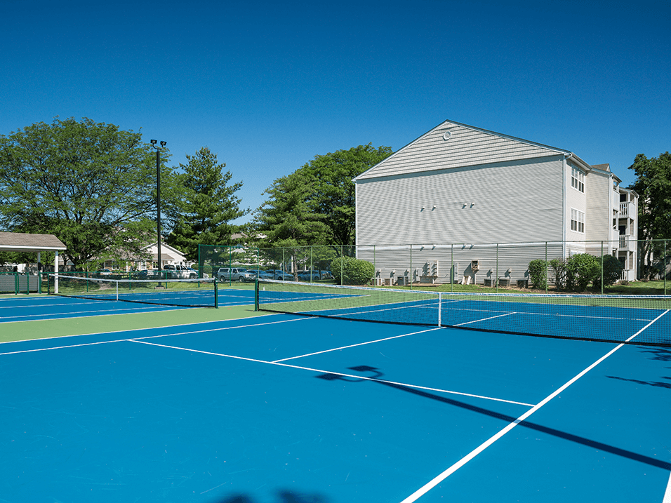tennis court at apartment community