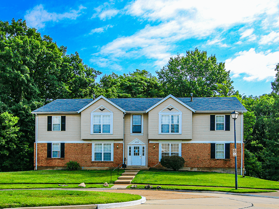 apartment building with a blue sky in the background