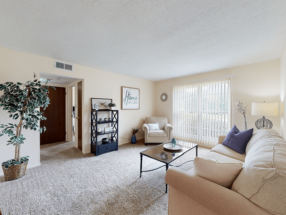 a living room with a couch and a chair
