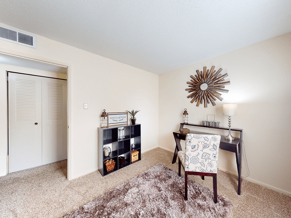 a home office with a desk and chair
