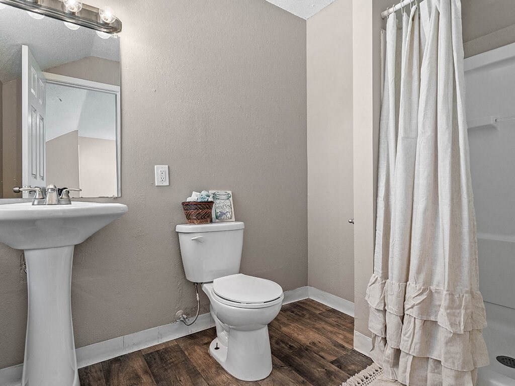 a bathroom with a toilet and a sink