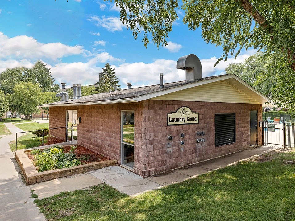 a brick building with a sign on the side of it
