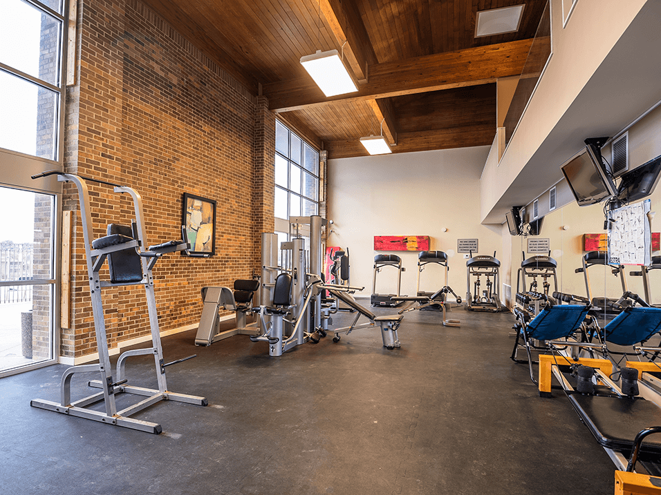 a fitness center with treadmills and other exercise equipment