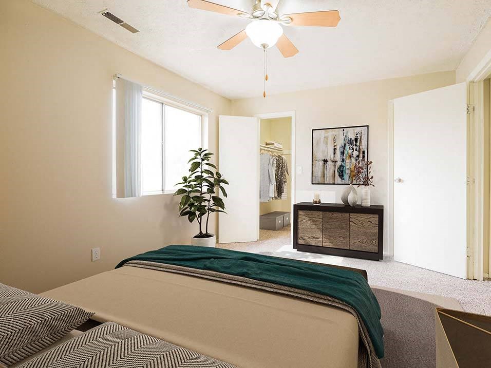 bedroom with large attached closet at georgetowne apartments