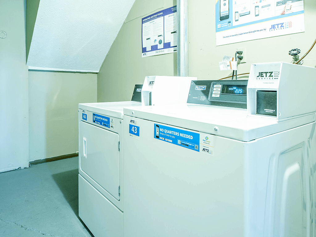a row of washing machines in a laundromat