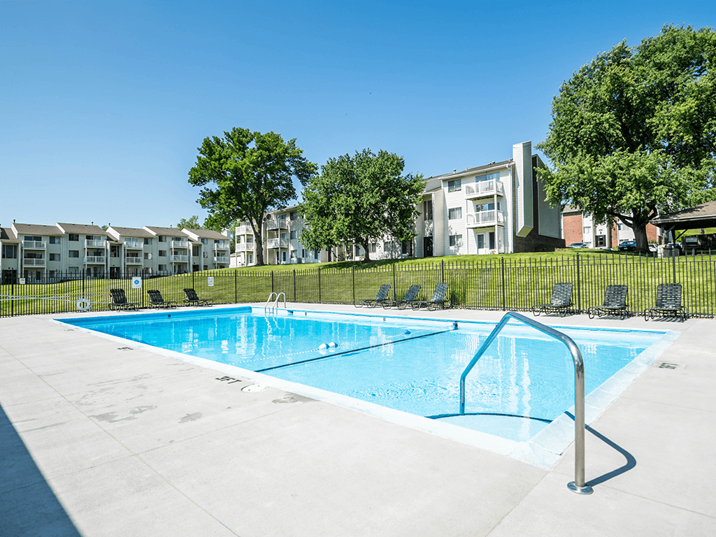 a swimming pool at apartment building