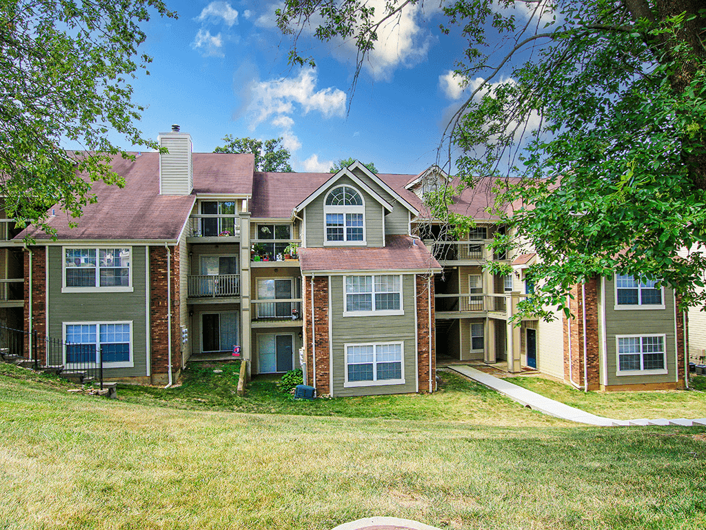 apartment building with shade trees