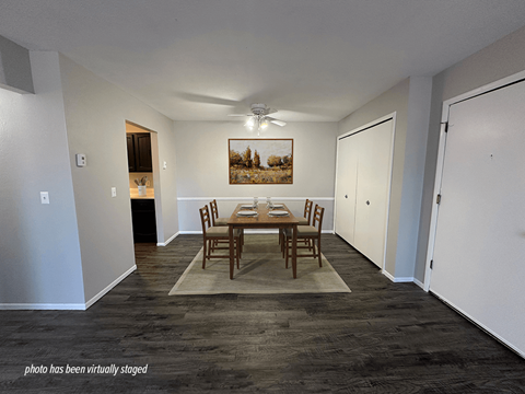 Apartment dining area with hardwood style flooring
