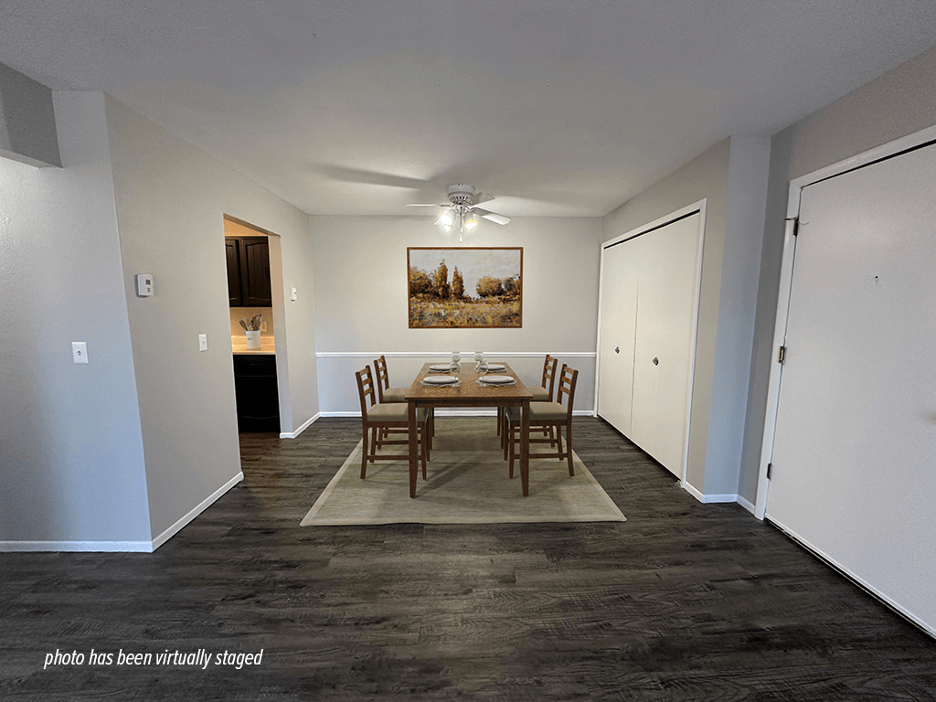 Apartment dining area with hardwood style flooring