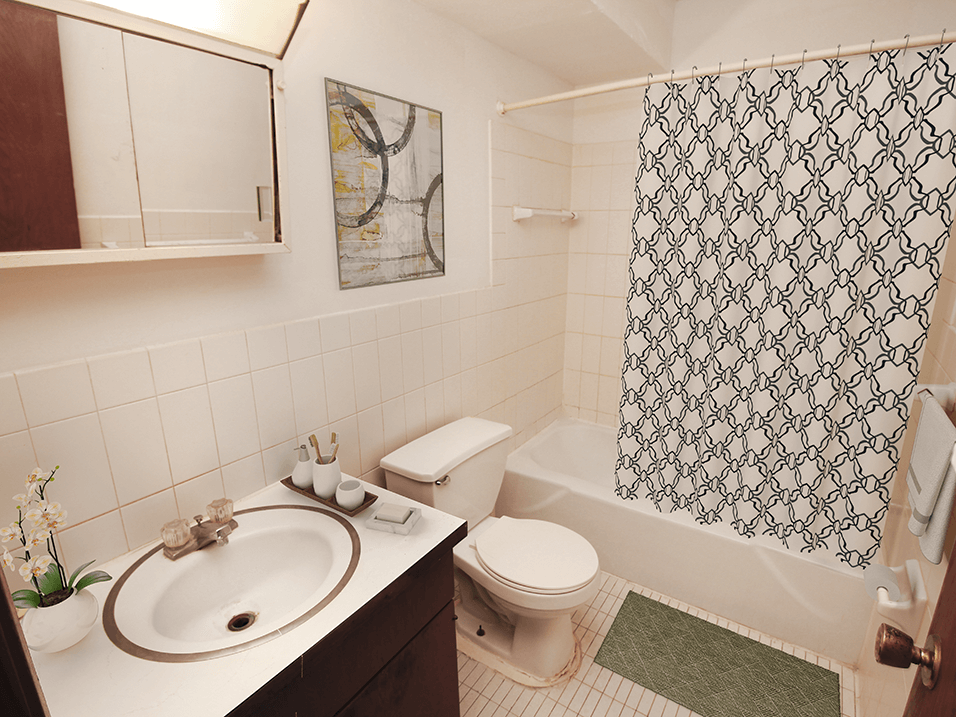 apartment bathroom with a sink toilet and bathtub