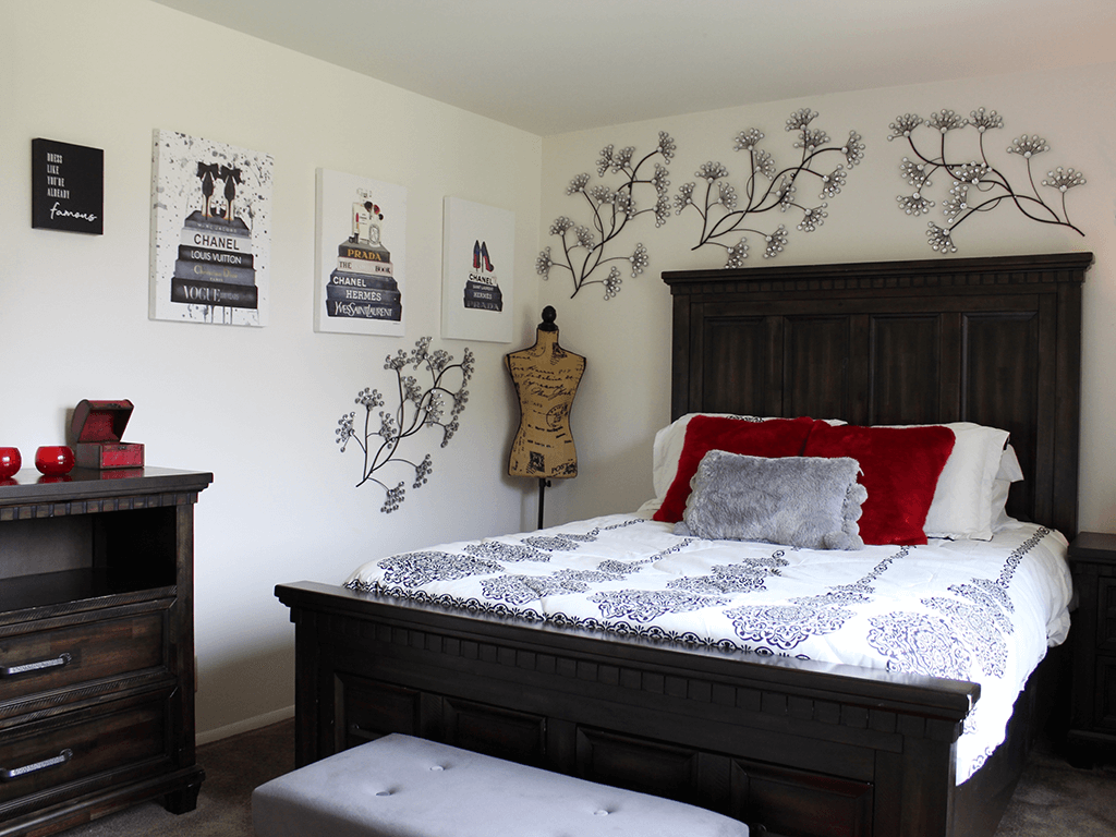 apartment bedroom with a bed and a dresser