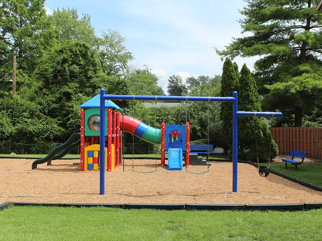 a playground with a slide at Imperial Gardens Apartments
