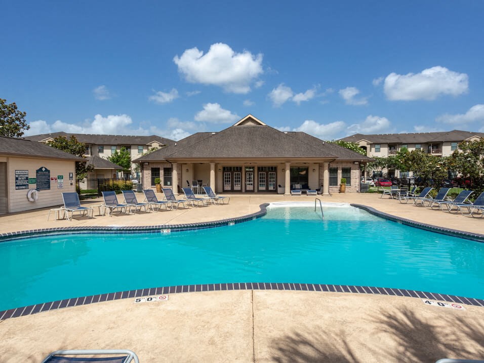 apartment complex with outdoor swimming pool