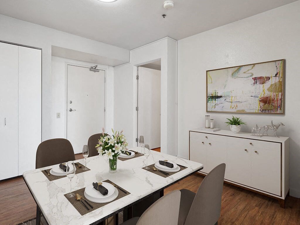 a dining room with a table and chairs