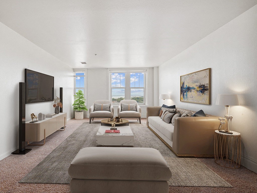 a living room with couches and chairs and a television